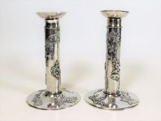 A pair of Wang Hing Chinese silver candlesticks de