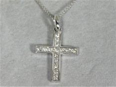 An 18ct white gold chain & crucifix set with approx. 0.7ct of diamonds