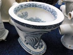 A blue & white transferware ceramic toilet with do