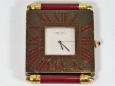 A Cartier travel alarm clock