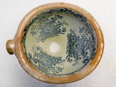 A c.1900 ceramic toilet pan with transferware flor