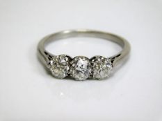 An 18ct white gold trilogy ring set with three old cut diamonds, approx. 1.25ct of H colour diamonds