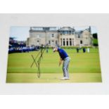 A hand signed Luke Donald golf photograph as acqui