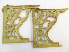 A pair of decorative Victorian cast iron brackets approx 17in high x 17.375in at widest point with f