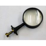 A painted brass mounted magnifying glass