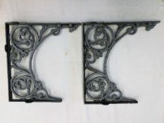 A pair of Victorian cast iron brackets approx 16.2