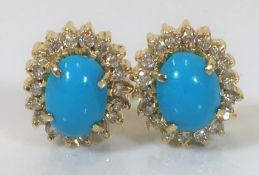 A pair of 18ct gold turquoise & diamond stud fitti