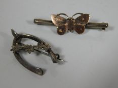 Two silver brooches, one overlaid with gold