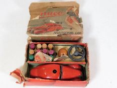 A Schuco tinplate steering car with accessories &