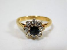 An 18ct gold diamond & sapphire ring