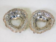 A pair of heart shaped silver bonbon dishes