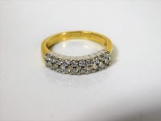 An 18ct gold & diamond half eternity ring 0.5cts
