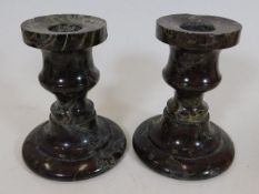 A pair of Cornish serpentine candlesticks