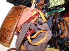 A collection of ten handbags including snakeskin