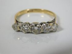 An 18ct gold five stone old cut diamond ring of ap