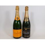 Two bottles of champagne - a bottle of Veuve Clicq