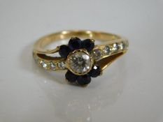 An 18ct gold diamond & sapphire ring
