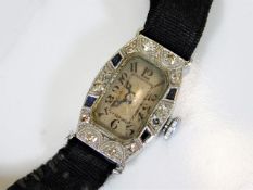 A platinum art deco cocktail watch set with diamon