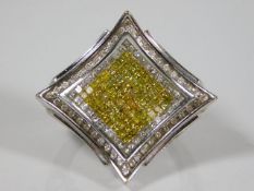 A large 14ct white gold ring set with approx. 1.7ct of canary & white diamonds 12.5g
