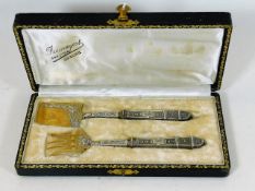 A boxed set of French silver cake servers