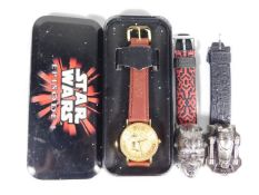 A Star Wars C-3PO wrist watch & two other Star War