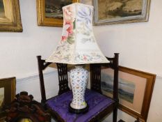 A floral design lamp with shade