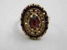 A 9ct gold Victorian garnet ring lacking one stone