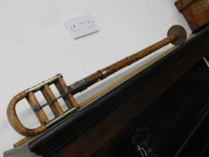 A Victorian brass & cane shooting stick