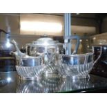 An antique three piece silver plated tea service