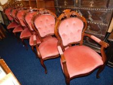 A set of six matching upholstered chairs including