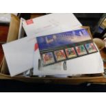 A boxed quantity of first day covers & mint stamps