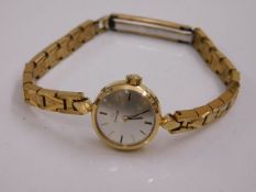 A ladies Omega wristwatch with plated strap & yell