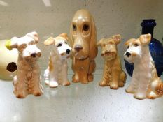 A collection of five Sylvac dogs