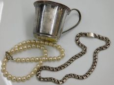 A silver necklace twinned with a plated christenin