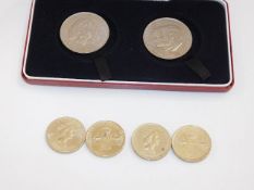 Four 1986 £2 coins & two crowns