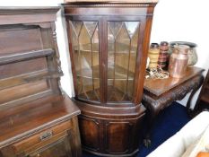 A double fronted large corner cabinet with flame m
