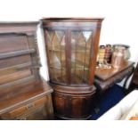 A double fronted large corner cabinet with flame m