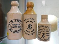 Three vintage stoneware ginger beer bottles