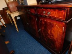 A flame mahogany sideboard with three cupboards &