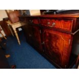 A flame mahogany sideboard with three cupboards &