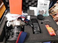 A Canon EOS 300 camera with accessories, tripod &
