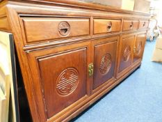A Chinese rosewood sideboard