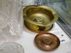 A trench art ashtray twinned with a similar trinke