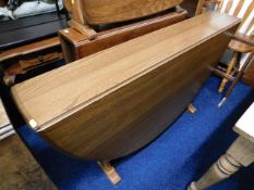 A D shaped Ercol elm drop leaf table with golden d