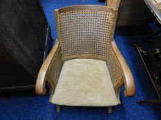 A low level oak & cane chair