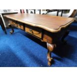 A late 20thC. three drawer coffee table