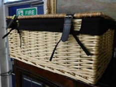A wicker picnic basket & one other