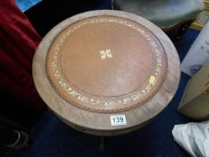 A small modern drum style table