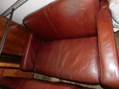 A small pair of leather two seater sofas