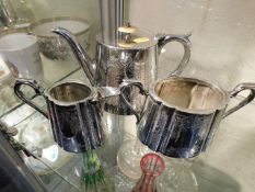 An antique silver plated tea service with inscript